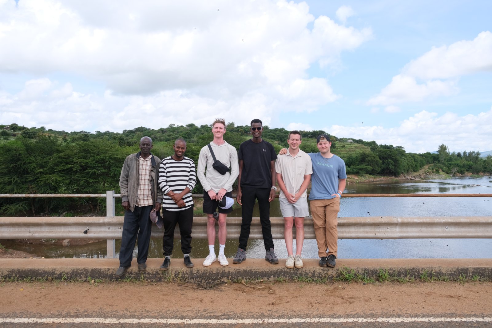 The full team — local partners and UVA interns — on a bridge in Wamunyu at the end of the visit.